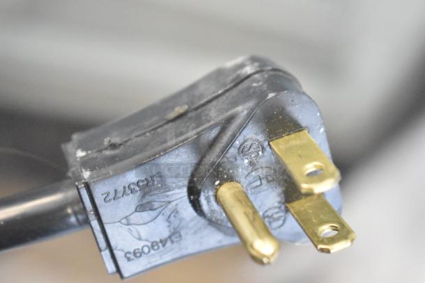 Close-up of a power plug for a 2019 Habco SE18 cooler. Standard 115 volts, single phase plug with manufacturer markings.