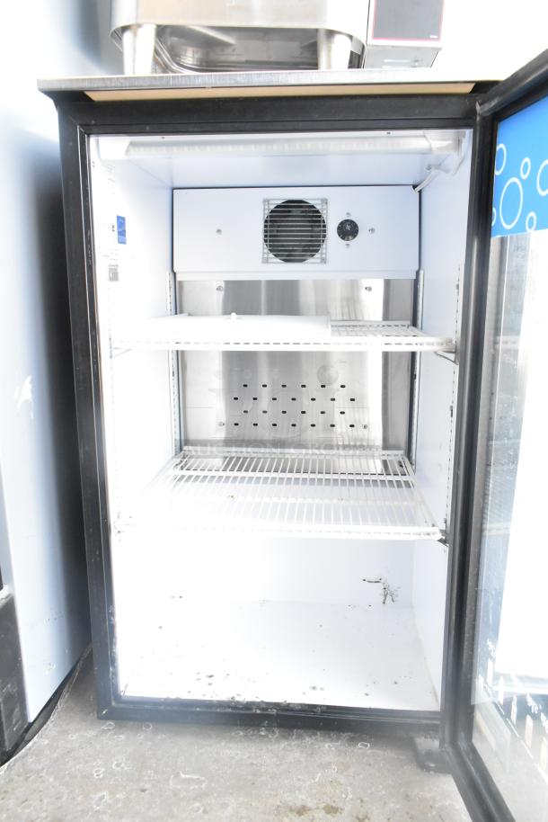 QBD DC6LP Commercial Single Door Mini Cooler Merchandiser, 115V, clean interior, shelving, visible fan and controls.