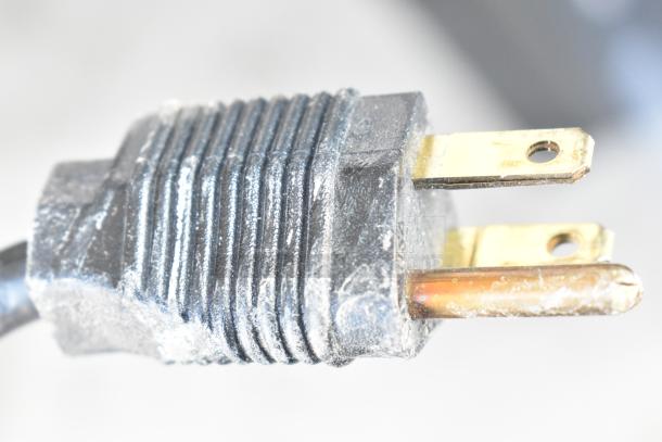 Close-up of a power plug from a Vita-Mix VM0800A Frozen Drink Mixer, showing a standard three-prong, 120V configuration.