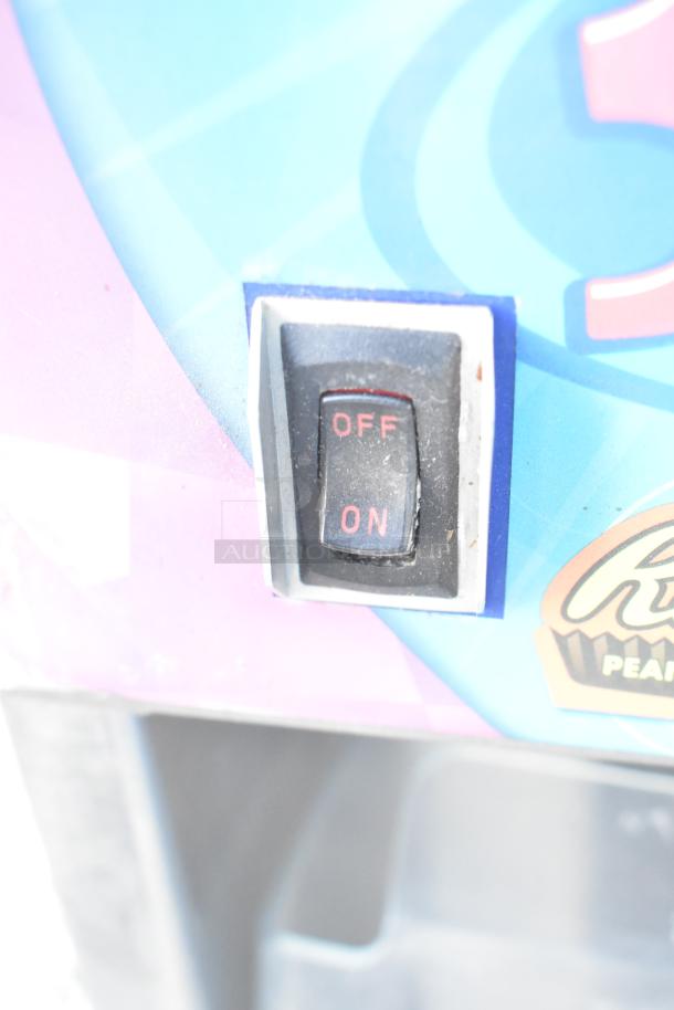 Vita-Mix VM0800A frozen drink mixer switch, labeled "On/Off," on colorful background.