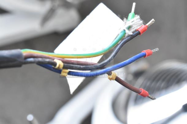 2024 Eurodib M40A Commercial Dough Mixer wiring close-up; connectors and label visible. Mixer attachments blurred in background.