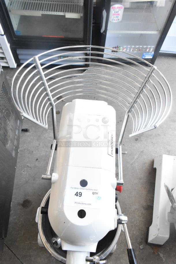 Eurodib M20A commercial dough mixer with 20-quart metal bowl, bowl guard, dough hook, whisk, and voltage info.