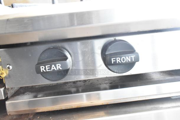 BT60-4N Commercial Gas Range, 4 burner controls labeled "REAR" and "FRONT," stainless steel, good condition.