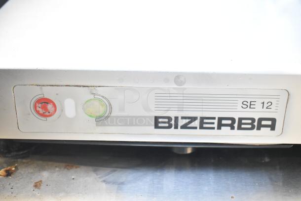 Bizerba SE 12 US commercial meat slicer with blade sharpener, 120V, 1 phase, visible buttons, model label on front.