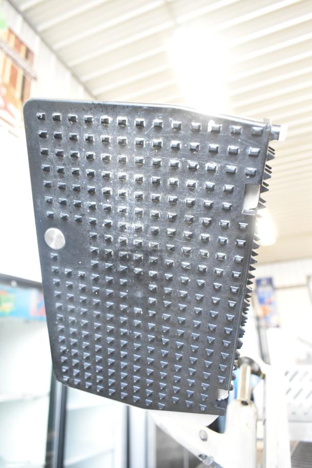 Bizerba SE 12 US commercial meat slicer, features blade sharpener. Appears in good condition, suitable for countertop use.