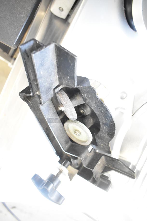 Bizerba SE 12 US meat slicer with blade sharpener, 120V, 1-phase, commercial use, showing close-up of blade sharpener mechanism.