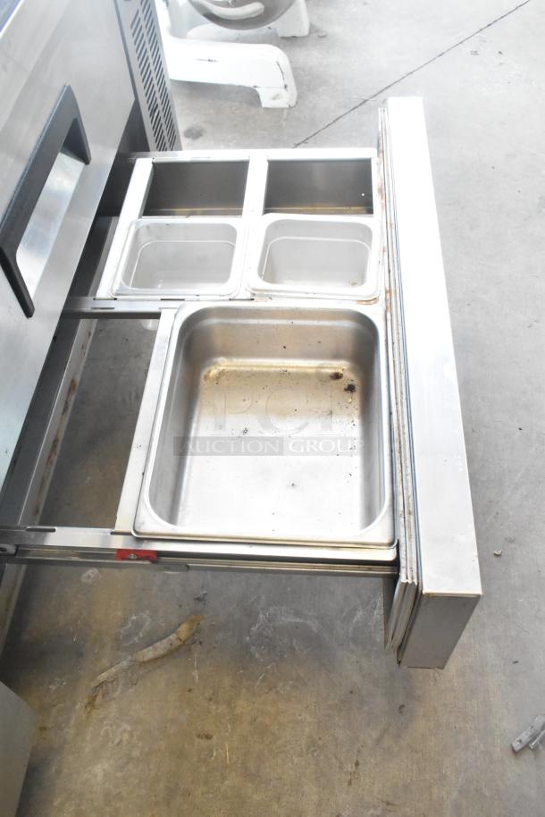 Coldline CB-72 commercial chef base with four drawers on casters. Includes food pans. 115 volts, 1 phase. Visible wear.