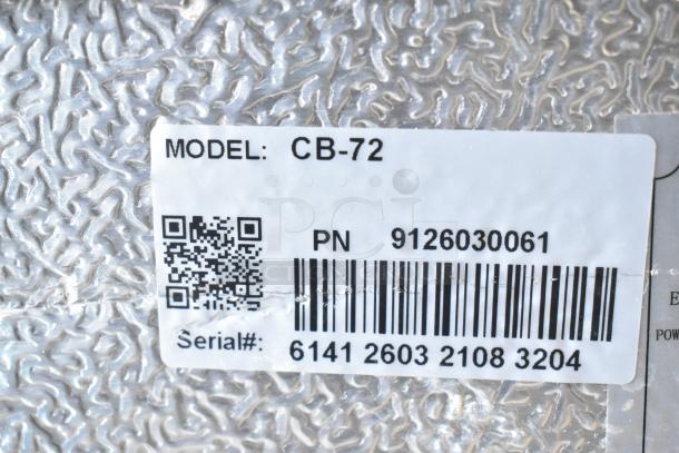 Coldline CB-72 chef base model label, includes QR code, part number, and serial number on textured metallic surface.