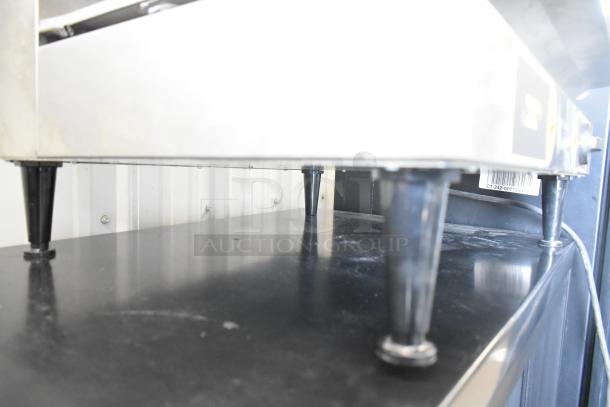 Equipex SEM60Q Commercial Salamander Cheese Melter, stainless steel, 208/240 volts, 1 phase, visible in good condition.