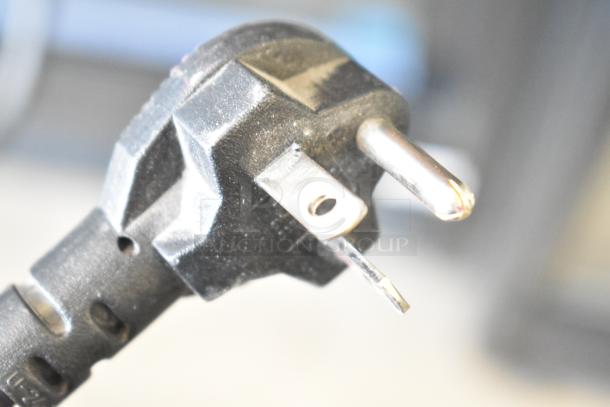 Close-up of a 3-prong plug for the Equipex SEM60Q Salamander Cheese Melter, 208/240V, 1 Phase.