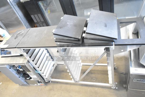 Commercial double pan rack with shelves, sturdy metal frame, commercial casters for mobility, in excellent condition.