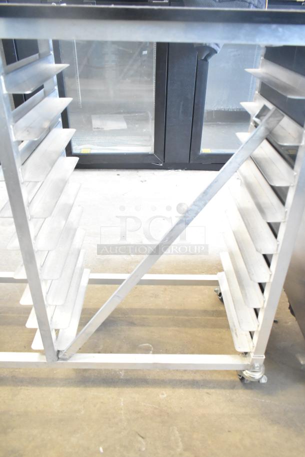 Commercial double pan rack with metal shelves, on sturdy commercial casters, excellent condition.