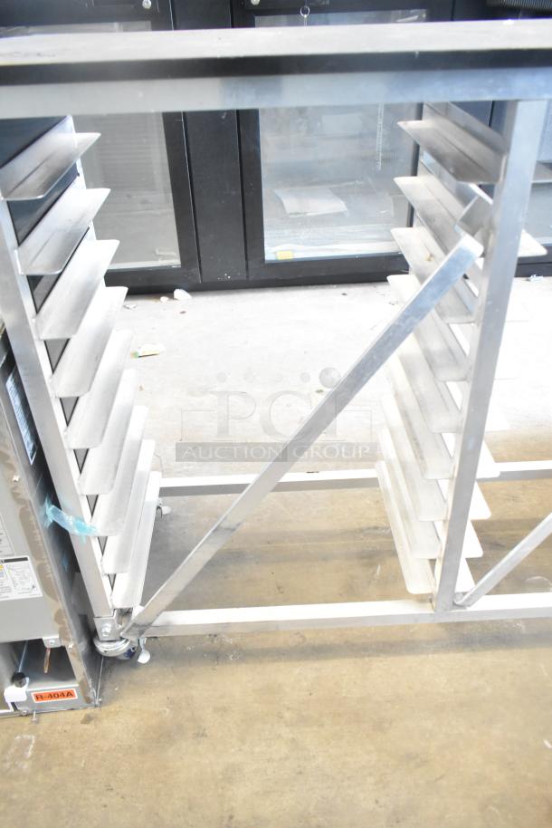 Commercial double pan rack on casters, featuring sturdy metal construction and ample shelving, ideal for kitchen use.
