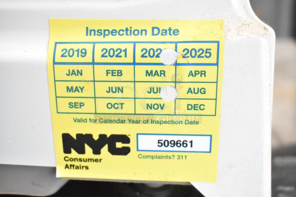 CAS S-2000 countertop scale, 30 lb capacity, inspection sticker shows valid dates for March and July. Model: S-2000.