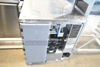 Hoshizaki KMD-410MAJ commercial ice machine, stainless steel, 115 volts, 1 phase, exposed internal components, minor surface wear.