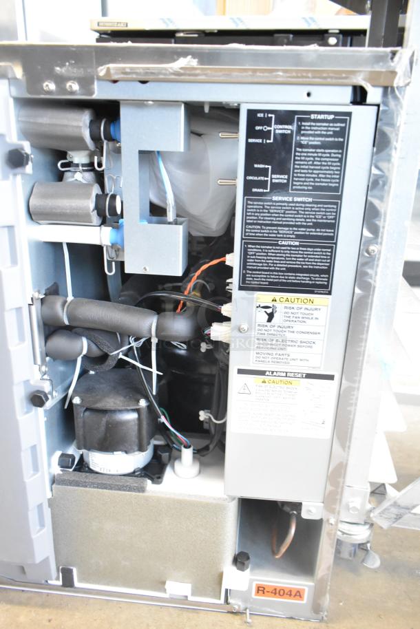 Hoshizaki KMD-410MAJ ice machine head, 115V, 1 phase, in good condition. Markings detail startup and service instructions.