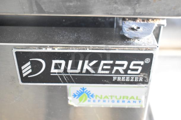 Dukers DUC29F commercial freezer, single door, undercounter, natural refrigerant label, visible wear, commercial casters.
