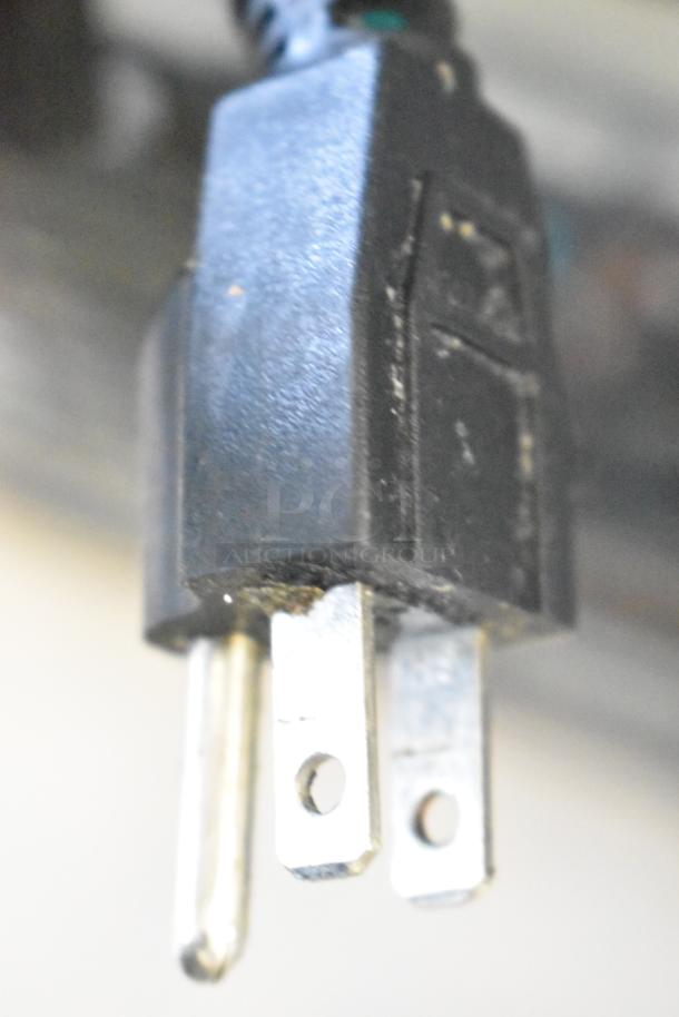 Close-up of power plug for Dukers DUC29F Commercial Freezer, showing standard three-prong design.