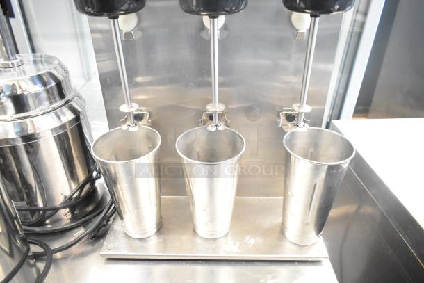 Waring 32DM16 Commercial Countertop 3 Head Drink Mixer in stainless steel, 120V, 1 Phase, used condition.