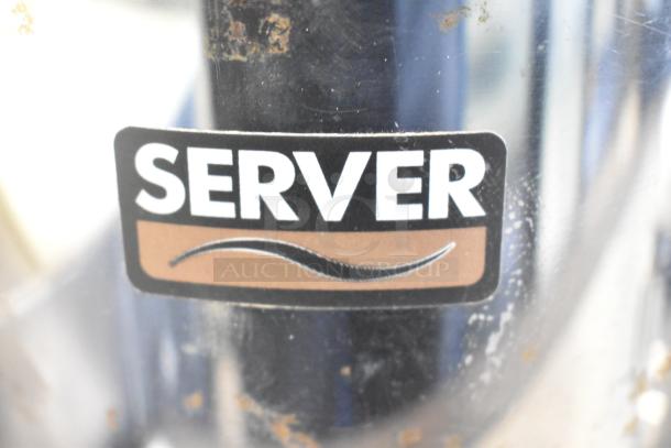 Server FSP Commercial Countertop Topping Warmer label, black and brown with wavy design. Visible wear and scratches.