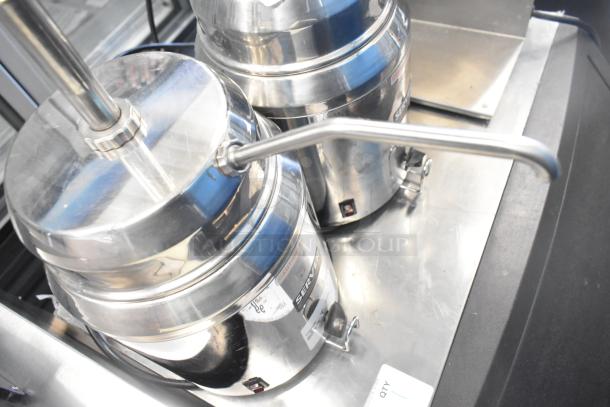 Two stainless steel Server FSP countertop topping warmers, 120 volts, with dispensing valves, and visible caution labels.