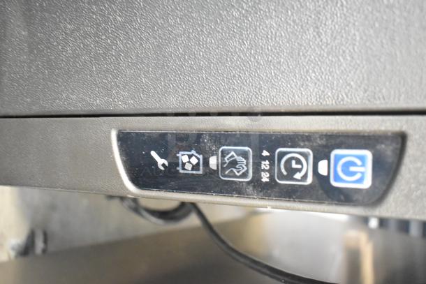 Manitowoc UYF0140A-161B ice machine, detail of control panel with power and icon buttons. 115 volts, 1 phase.