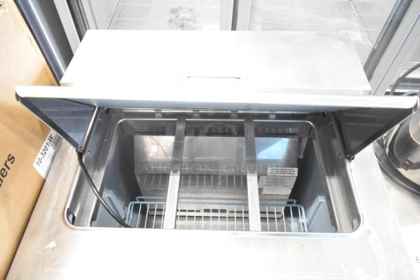 Delfield 4427N-6-DHL-BR2 commercial salad prep table, stainless steel, bain marie top, on casters, 115V, 1 phase.