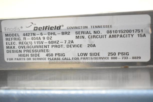 Delfield 4427N-6-DHL-BR2 prep table label showing model, serial number, and electrical specs.