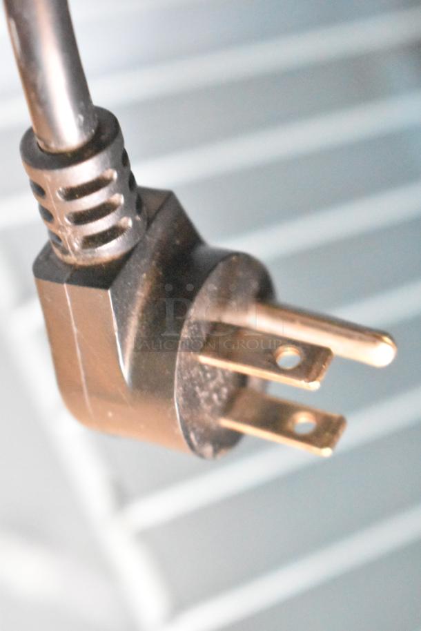 Power plug of Delfield 4427N-6-DHL-BR2 commercial prep table, 115 volts, for sandwich and salad preparation.