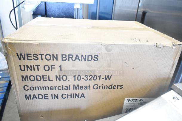 Brand new Weston 10-3201-W #32 Pro Series Electric Meat Grinder in a slightly damaged box. Model and specs visible.