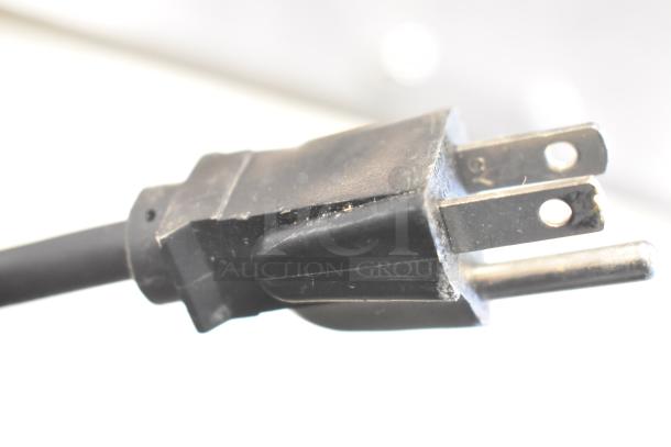 Close-up of a power plug for a Hatco GRFFL Glo-ray Heat Strip Warmer, 120 volts, 1 phase. Plug shows signs of wear.
