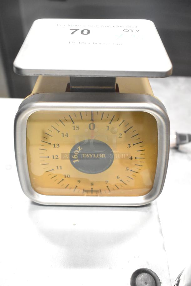 Taylor analog kitchen scale with stainless steel frame and yellow face, marked 16oz capacity, in used condition.