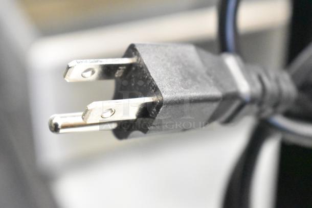 Power plug of Yjingrui Countertop Automatic Fructose Dispenser, 110V, 1 Phase, black, close-up view.