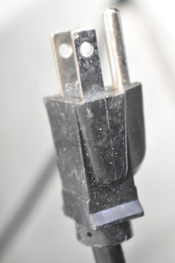 Close-up of a black three-prong power plug for the Hatco Countertop Food Warming Strip Station, 120 Volts, 1 Phase.