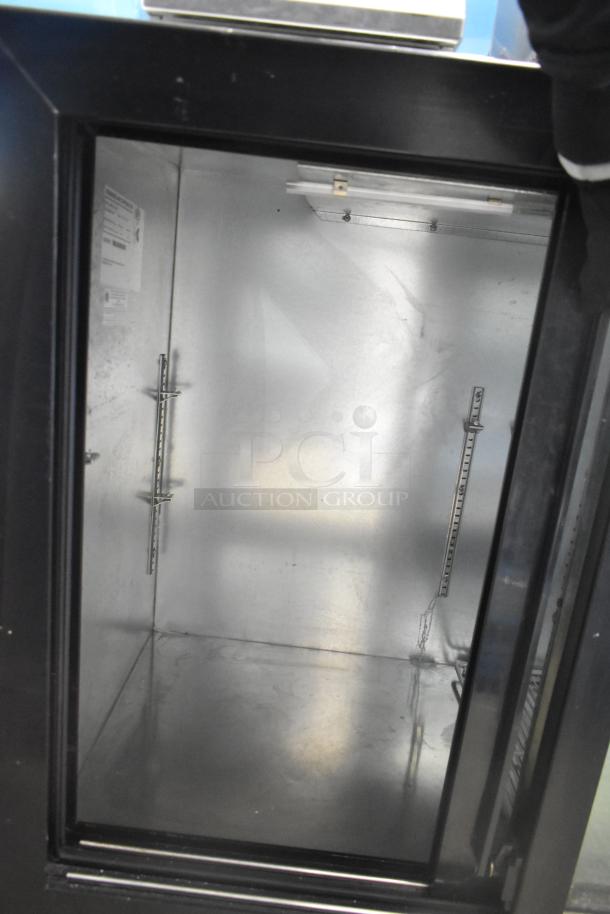 Beverage Air BB72HC-1-GS-B cooler, 3 glass doors, commercial use, interior shelving, 115V, black exterior, well-maintained.