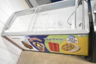 SD-575 Commercial Novelty Ice Cream Freezer Merchandiser, 115 Volts, 1 Phase, with sliding glass top, featuring colorful ice cream branding.