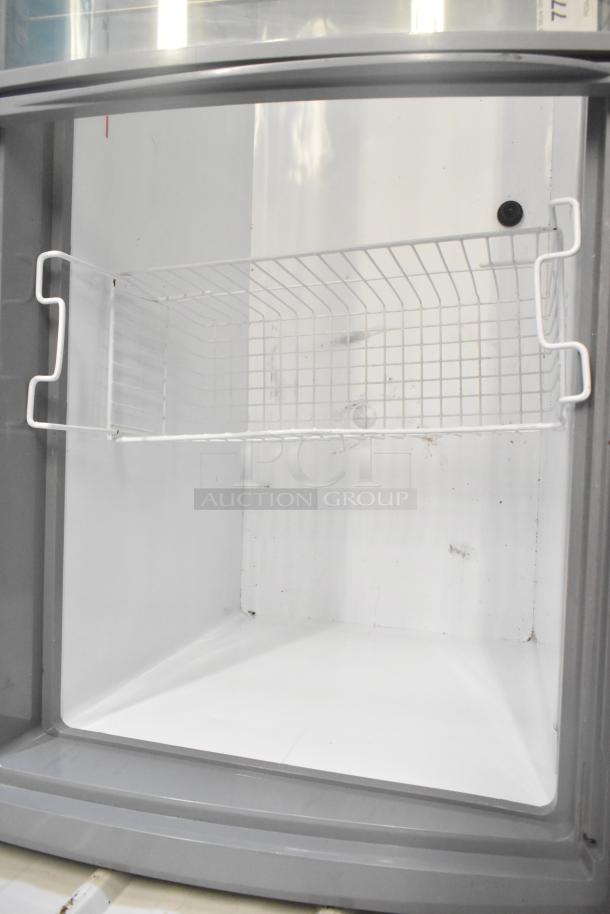 SD-575 Commercial Novelty Ice Cream Freezer, white interior, sturdy wire shelf, 115 volts, 1 phase, excellent condition.