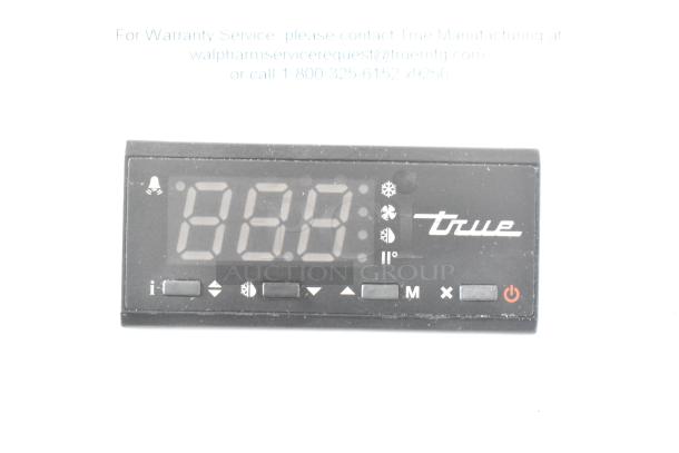 Close-up of control panel with digital display for True TSCI-600R-G-PH Commercial Cooler. Various control icons visible.