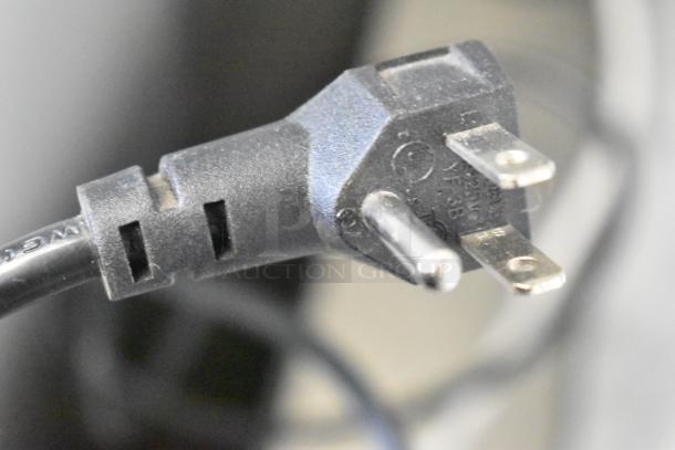 Close-up of a power plug attached to an Imbera EVC04 Commercial Mini Cooler Merchandiser, 115 Volts, 1 Phase.