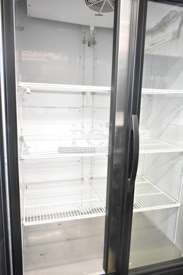 2024 True GDM-35-HC 2-door commercial reach-in cooler, 115V, excellent condition, includes wire shelves.