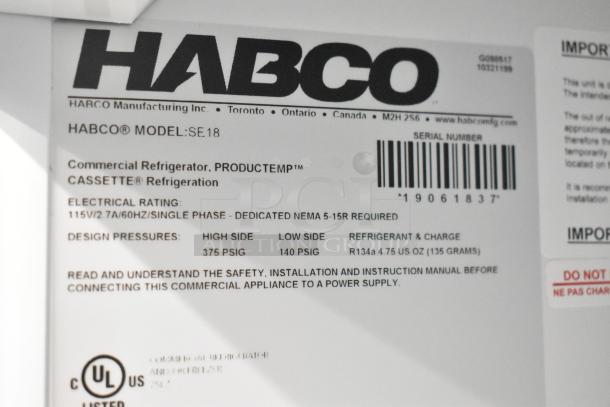 2019 Habco SE18 Cooler label showing model, electrical rating (115V, 1 phase), refrigerant info, and safety instructions.