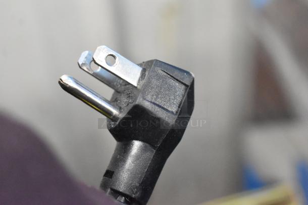 Close-up of a power plug for the Imbera EVC04 Commercial Mini Cooler Merchandiser, 115 Volts, 1 Phase.