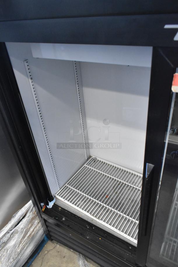 2019 True GDM-41SL-48-HC-LD commercial reach-in cooler with two glass doors; interior shelves visible.