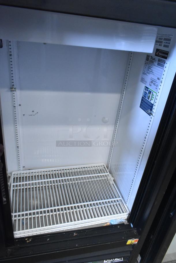 2019 True GDM-41SL-48-HC-LD commercial cooler, 2 doors, white interior, shelving intact, power info decal inside.