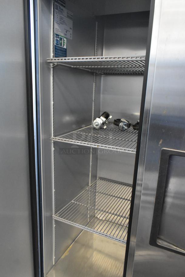 2021 True T-35-HC Commercial 2 Door Reach In Cooler, 115 Volts, 1 Phase, with shelves and visible model tags.