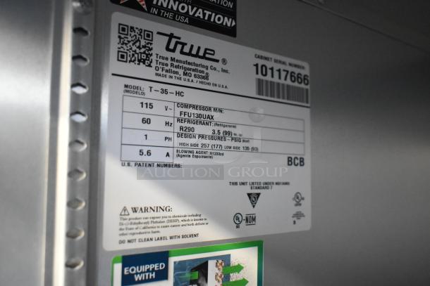 2021 True T-35-HC Commercial Cooler label with specs, 115V, 1 phase, includes refrigerant info and safety warnings.
