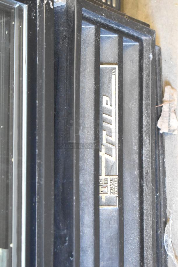 True GDM-12-HC-LD single door cooler merchandiser, featuring a True logo label, 115 volts, 1 phase, in used condition.