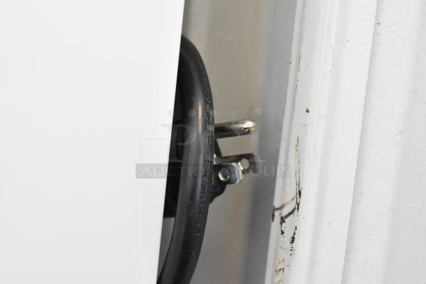 Close-up of power cord for 2019 Habco SE18 Commercial Cooler, 115 volts, single-phase. Black cord with visible prongs.