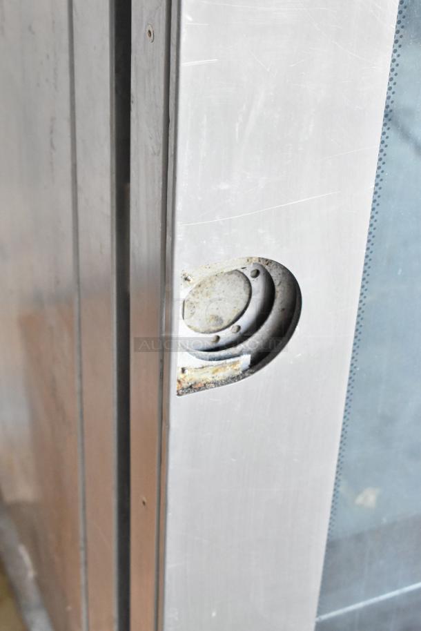 Blodgett BCM 2.10 commercial convection oven detail, stainless steel, shows wear on door handle area. Natural gas, 92,000 BTU.