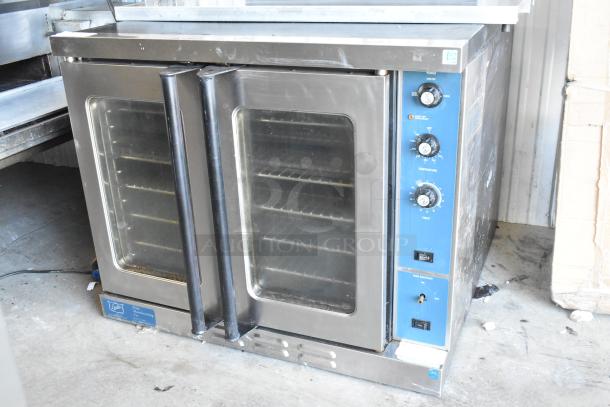 Duke commercial full-size convection oven with view-through doors, thermostatic controls, and blue panel. Used condition.